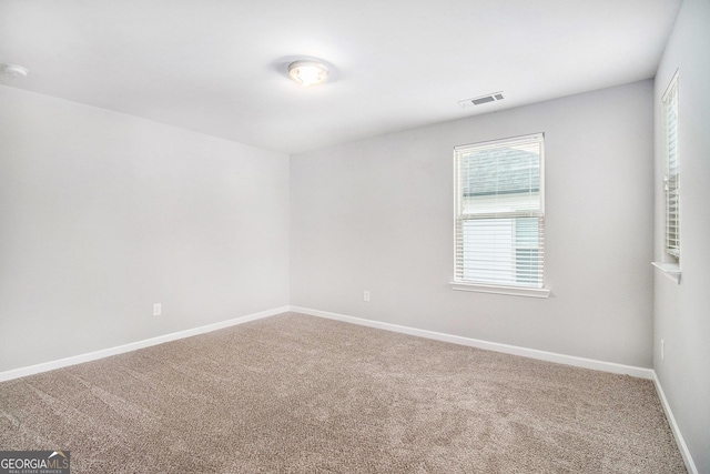 2769 Morgan Spring Trl, Buford, GA 30519 - spare room featuring carpet flooring and baseboards
