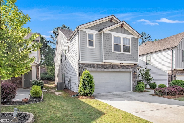 2769 Morgan Spring Trl, Buford, GA 30519 - view of front facade with a garage, central air condition unit, stone siding, concrete driveway, and a front lawn