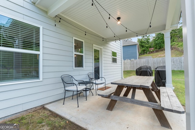 view of patio / terrace featuring outdoor dining space, fence, and area for grilling