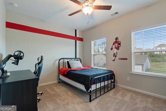 bedroom with carpet, baseboards, and ceiling fan