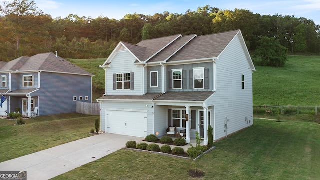 traditional-style home featuring driveway, a garage, a shingled roof, and a forest view