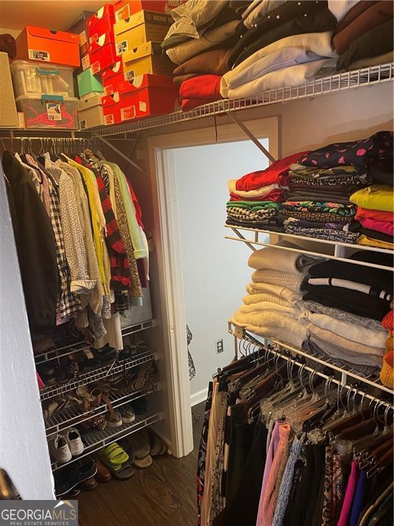 2700 Pine Tree Rd NE Unit 2204, Atlanta, GA 30324 - walk in closet featuring wood finished floors