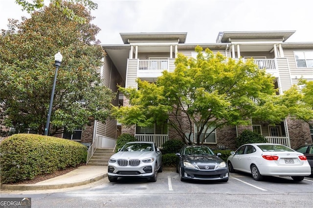 2700 Pine Tree Rd NE Unit 2204, Atlanta, GA 30324 - view of property featuring uncovered parking