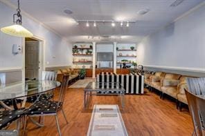 2700 Pine Tree Rd NE Unit 2204, Atlanta, GA 30324 - dining room featuring wood finished floors, crown molding, and track lighting