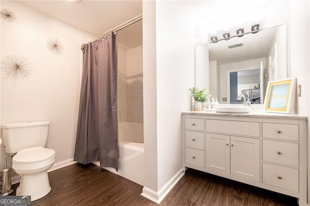 2700 Pine Tree Rd NE Unit 2204, Atlanta, GA 30324 - full bathroom with wood finished floors, vanity, and shower / tub combo with curtain