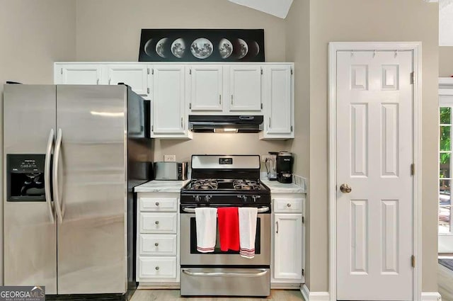 kitchen featuring stainless steel appliances, under cabinet range hood, light countertops, and white cabinetry