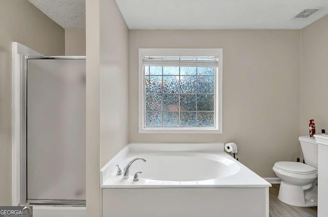 full bath with toilet, a shower stall, and a bath