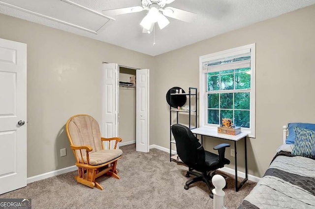 home office with a ceiling fan, light colored carpet, and baseboards