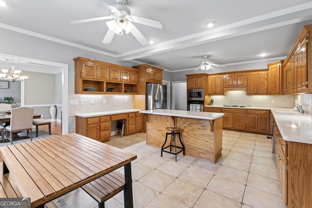 510 Jenna Trl, Mcdonough, GA 30252 - kitchen with appliances with stainless steel finishes, decorative backsplash, a sink, a kitchen island, and light countertops