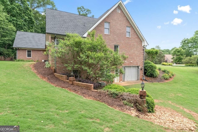510 Jenna Trl, Mcdonough, GA 30252 - view of home's exterior with brick siding, a garage, and a lawn