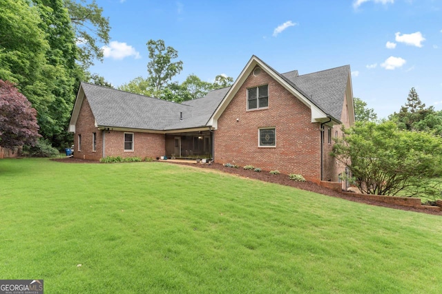 510 Jenna Trl, Mcdonough, GA 30252 - rear view of house featuring brick siding, a yard, and roof with shingles