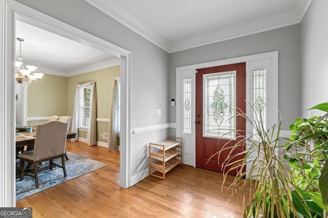 510 Jenna Trl, Mcdonough, GA 30252 - foyer entrance featuring light wood-style floors, a chandelier, ornamental molding, and baseboards