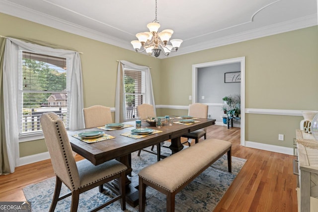 510 Jenna Trl, Mcdonough, GA 30252 - dining area featuring a chandelier, ornamental molding, light wood-type flooring, and baseboards