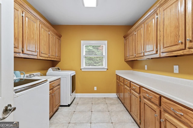 510 Jenna Trl, Mcdonough, GA 30252 - clothes washing area with cabinet space, washing machine and clothes dryer, baseboards, and light tile patterned flooring