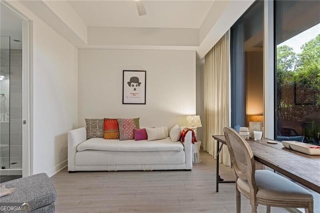 1820 Peachtree St Unit 311, Atlanta, GA 30309 - living area with light wood finished floors and a ceiling fan