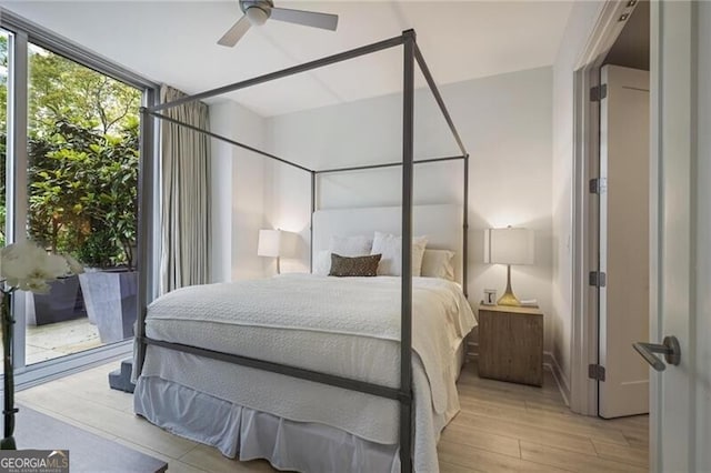 1820 Peachtree St Unit 311, Atlanta, GA 30309 - bedroom with light wood-style floors, ceiling fan, and expansive windows