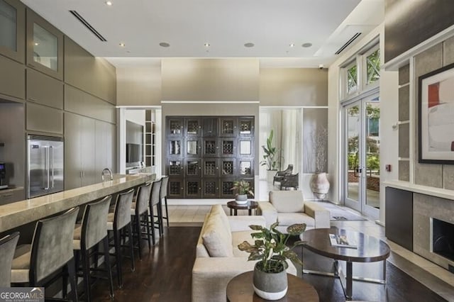 1820 Peachtree St Unit 311, Atlanta, GA 30309 - living area featuring a towering ceiling and wood finished floors