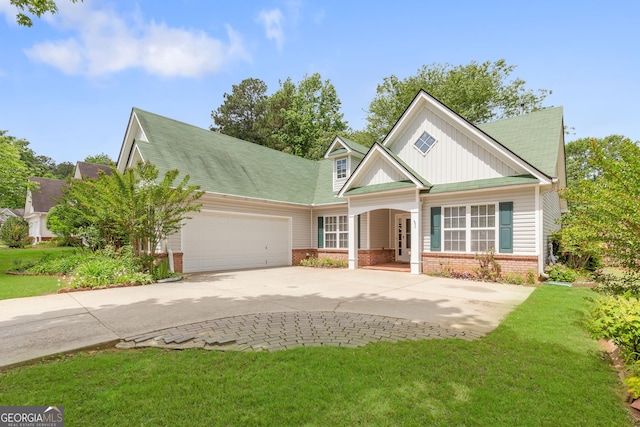 view of front of property with brick siding, concrete driveway, an attached garage, a front lawn, and board and batten siding
