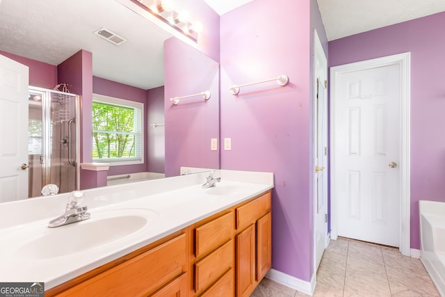 full bathroom featuring a stall shower, a bath, baseboards, double vanity, and marble look tile flooring