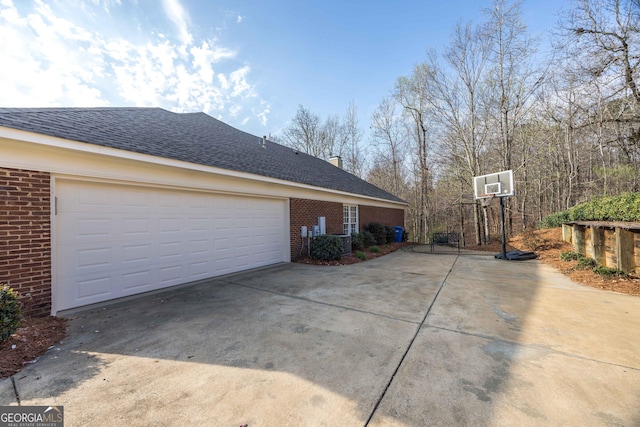 4722 Timarron Loop, Columbus, GA 31904 - view of property exterior featuring brick siding, driveway, a garage, and roof with shingles