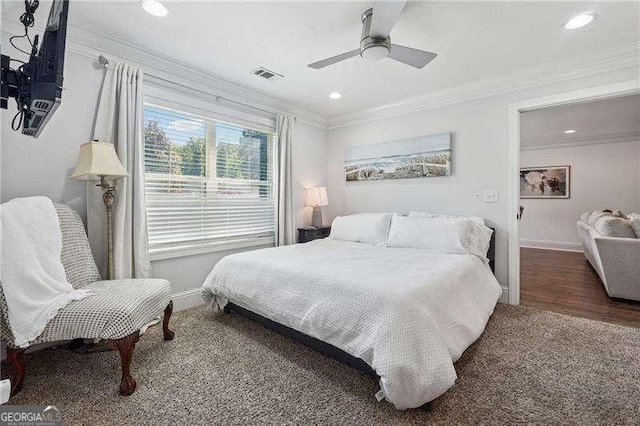 carpeted bedroom featuring crown molding, baseboards, a ceiling fan, and recessed lighting