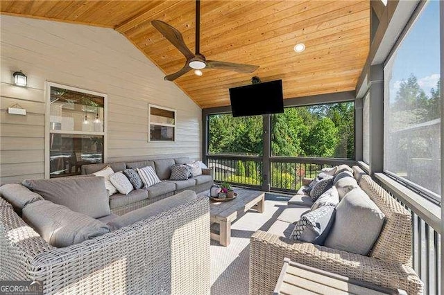 sunroom / solarium with outdoor lounge area, a ceiling fan, and vaulted ceiling