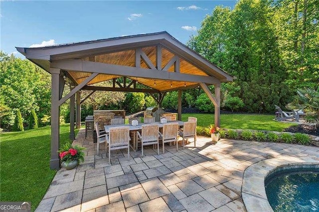 view of patio with a gazebo and outdoor dining space
