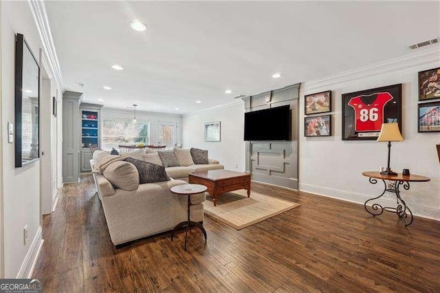 living room with ornamental molding, wood finished floors, recessed lighting, and baseboards
