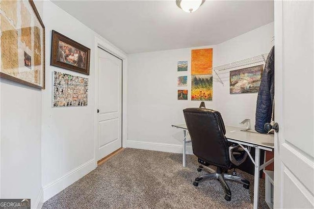 carpeted home office with baseboards