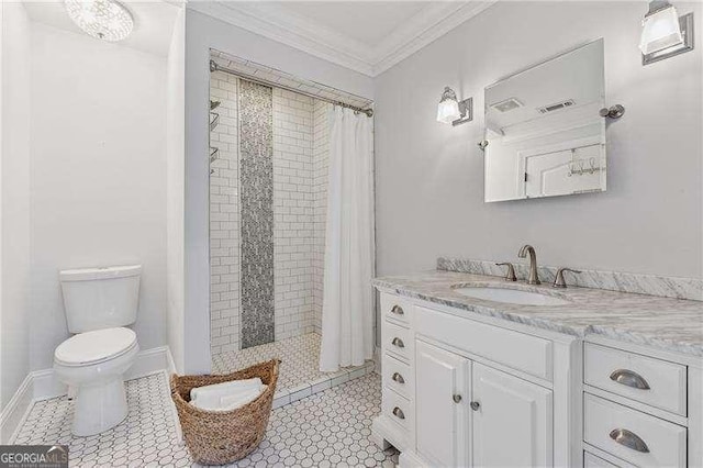 bathroom featuring toilet, ornamental molding, a stall shower, and vanity