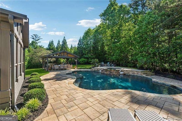view of pool with a gazebo, a patio area, and a pool with connected hot tub