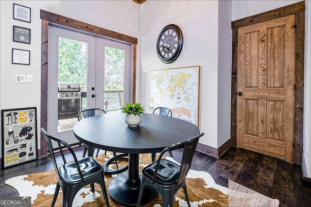 dining area with french doors, dark wood-style flooring, and baseboards
