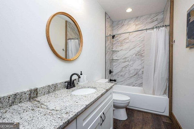 full bathroom with wood finished floors, vanity, toilet, shower / tub combo, and recessed lighting