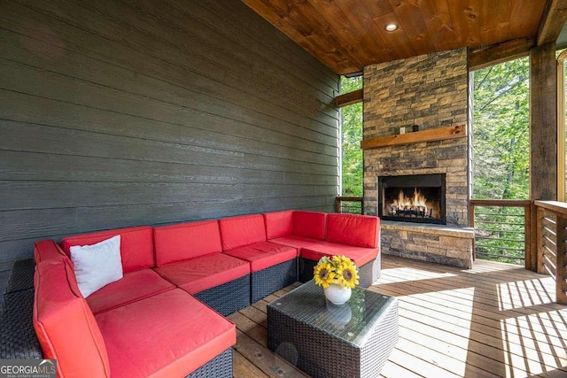 deck featuring an outdoor living space with a fireplace