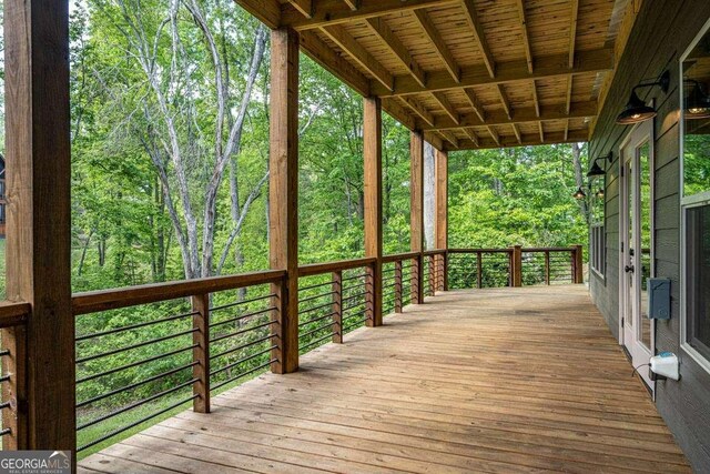 deck featuring a wooded view