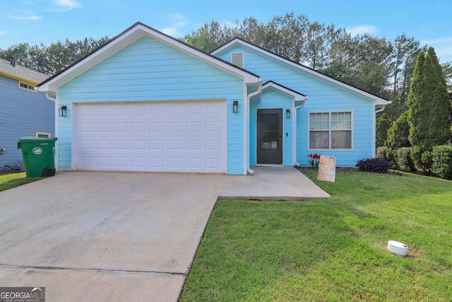 ranch-style home featuring driveway, a front yard, and an attached garage