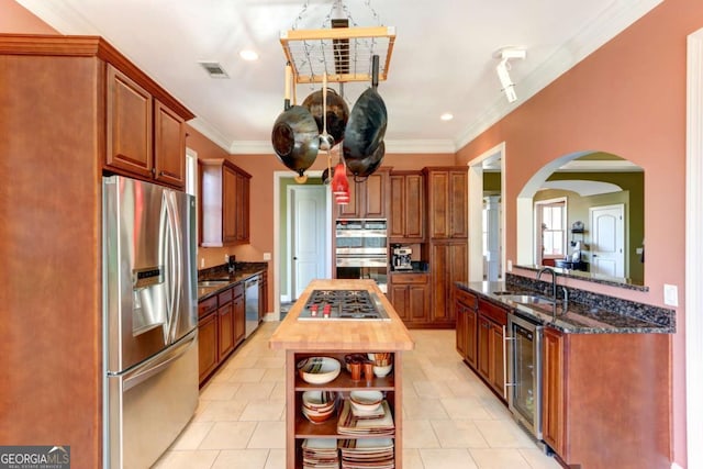 18 Enclave Cir, Savannah, GA 31419 - kitchen with stainless steel appliances, a sink, beverage cooler, crown molding, and open shelves