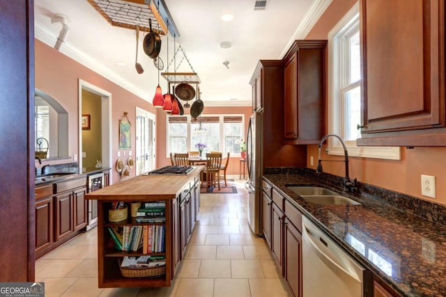 18 Enclave Cir, Savannah, GA 31419 - kitchen with appliances with stainless steel finishes, a sink, butcher block countertops, beverage cooler, and crown molding