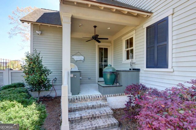 18 Enclave Cir, Savannah, GA 31419 - property entrance featuring a ceiling fan, roof with shingles, and a surveillance system