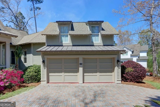 18 Enclave Cir, Savannah, GA 31419 - view of front of house with a standing seam roof, decorative driveway, metal roof, a garage, and a shingled roof