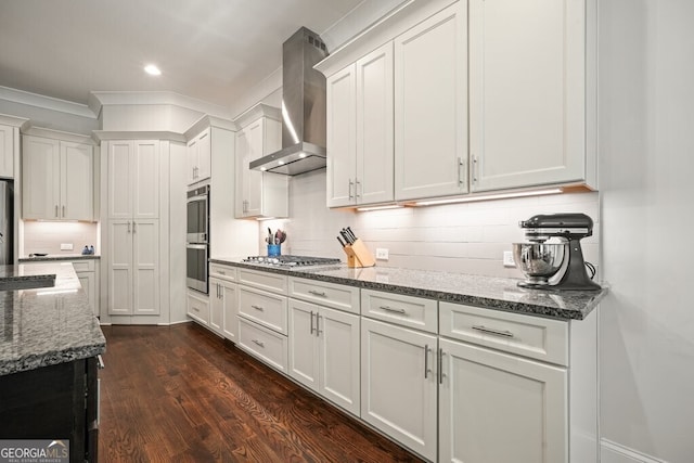 2861 Digna Ct, Acworth, GA 30101 - kitchen with wall chimney exhaust hood, appliances with stainless steel finishes, white cabinets, decorative backsplash, and crown molding