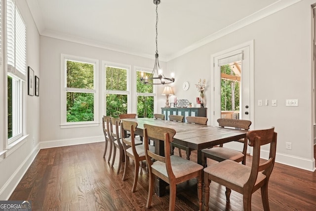 2861 Digna Ct, Acworth, GA 30101 - dining space featuring dark wood-style flooring, ornamental molding, and a chandelier