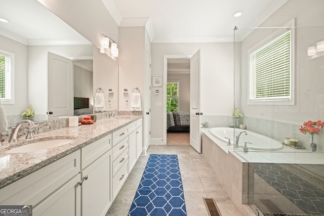 2861 Digna Ct, Acworth, GA 30101 - bathroom featuring crown molding, double vanity, a garden tub, ensuite bath, and tile patterned floors