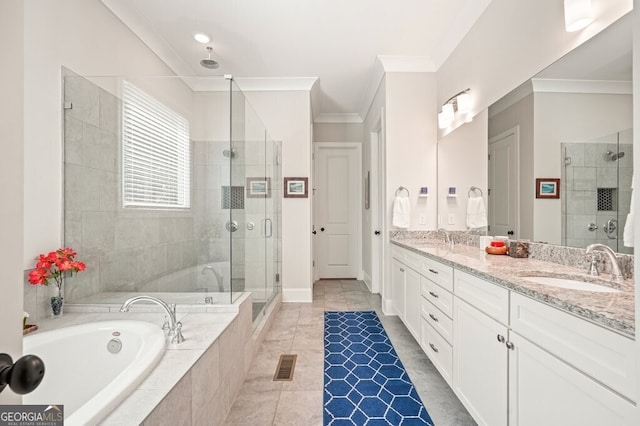 2861 Digna Ct, Acworth, GA 30101 - bathroom featuring crown molding, a shower stall, a garden tub, and double vanity