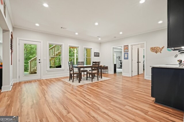 2861 Digna Ct, Acworth, GA 30101 - dining area with healthy amount of natural light, crown molding, light wood-style floors, and recessed lighting