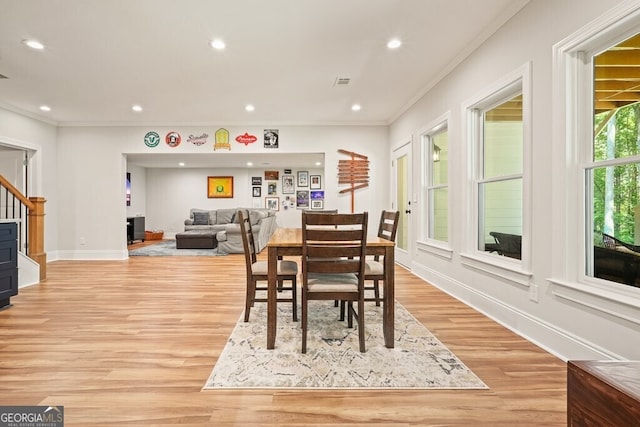 2861 Digna Ct, Acworth, GA 30101 - dining space featuring crown molding, light wood finished floors, recessed lighting, and stairway