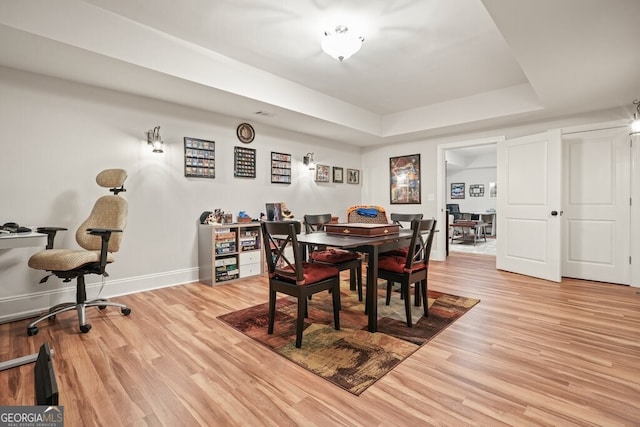 2861 Digna Ct, Acworth, GA 30101 - dining area with a tray ceiling and wood finished floors