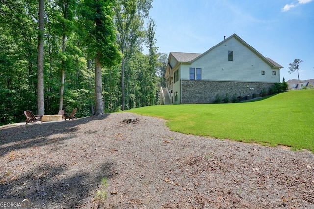 2861 Digna Ct, Acworth, GA 30101 - view of home's exterior featuring stone siding and a yard