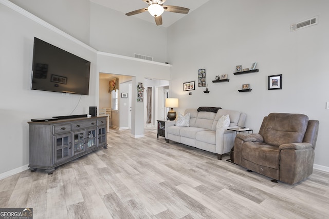 3 Bluegrass Pass, Newnan, GA 30263 - living room with a ceiling fan, baseboards, light wood-style flooring, and high vaulted ceiling