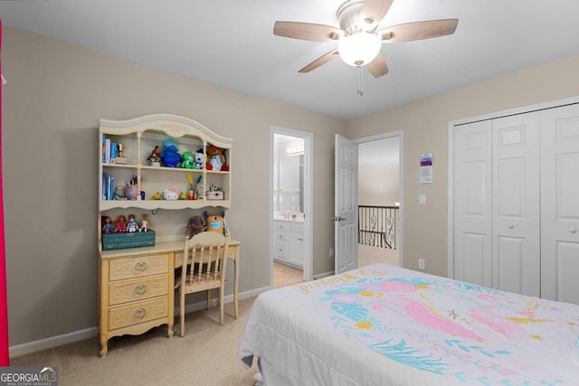 2759 Thomashire Trce, Marietta, GA 30066 - bedroom with light carpet, a closet, baseboards, a ceiling fan, and connected bathroom
